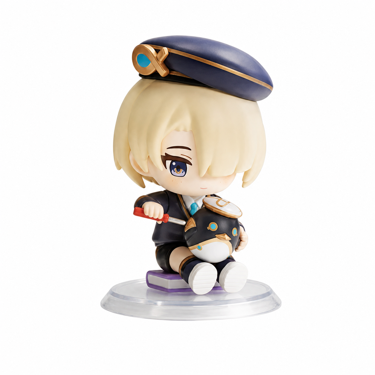 POP MART Freminet Confirmed Figure. Freminet sits with blond hair covering one eye, a blue-and-gold cap and dark clothes. A small red object and purple book add detail around the seated pose.