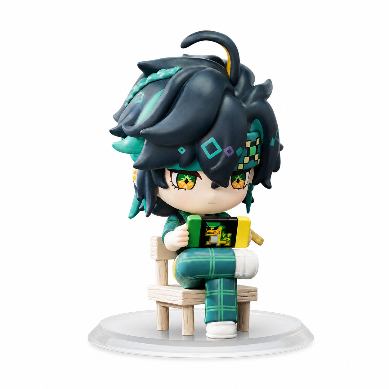 POP MART Kinich Confirmed Figure. Kinich sits on a small chair with a rectangular object in his hands. Black-and-teal hair and yellow-green eyes carry over into this school-themed design.
