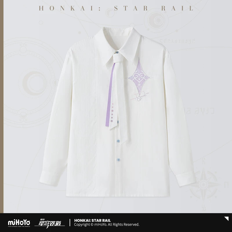 Cyrene — Shirt with Tie. A white long-sleeved shirt with pastel buttons, a star-and-infinity chest motif and embroidery across the upper back. The accompanying narrow two-tone tie adds a coordinated detail at the collar.